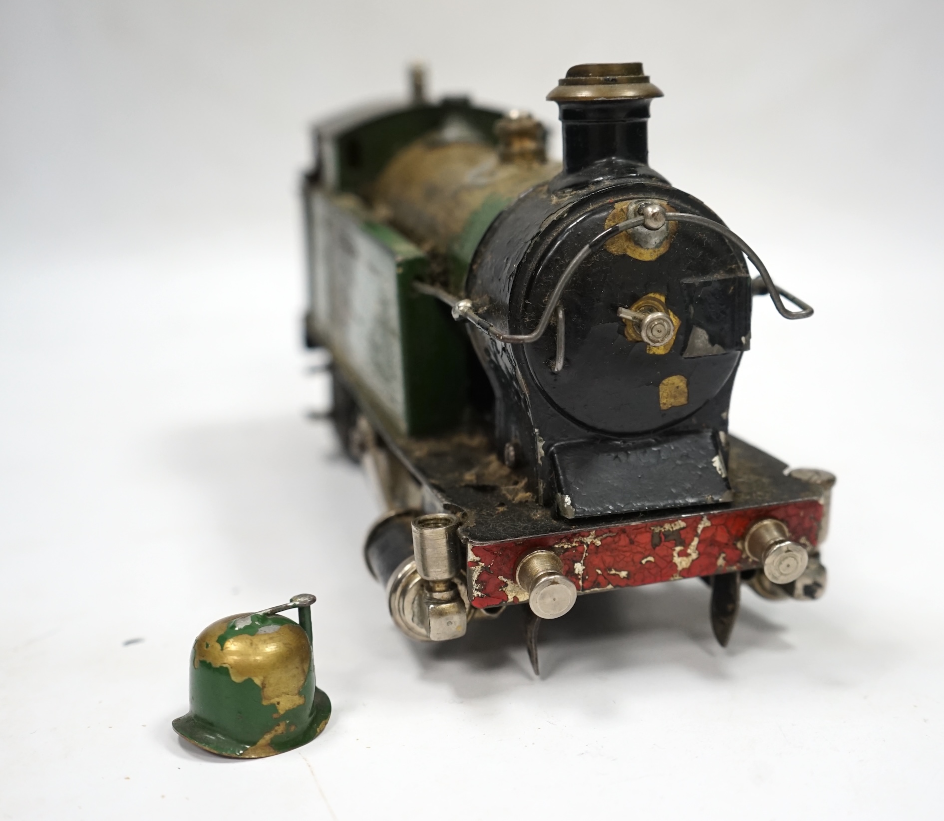 A Trix Twin Railway 00 gauge train set box containing; four locomotives, eight bogie coaches, two railcars, and six freight wagons, together with a live steam Marklin 0-4-0T LNER locomotive. Condition - poor to fair.